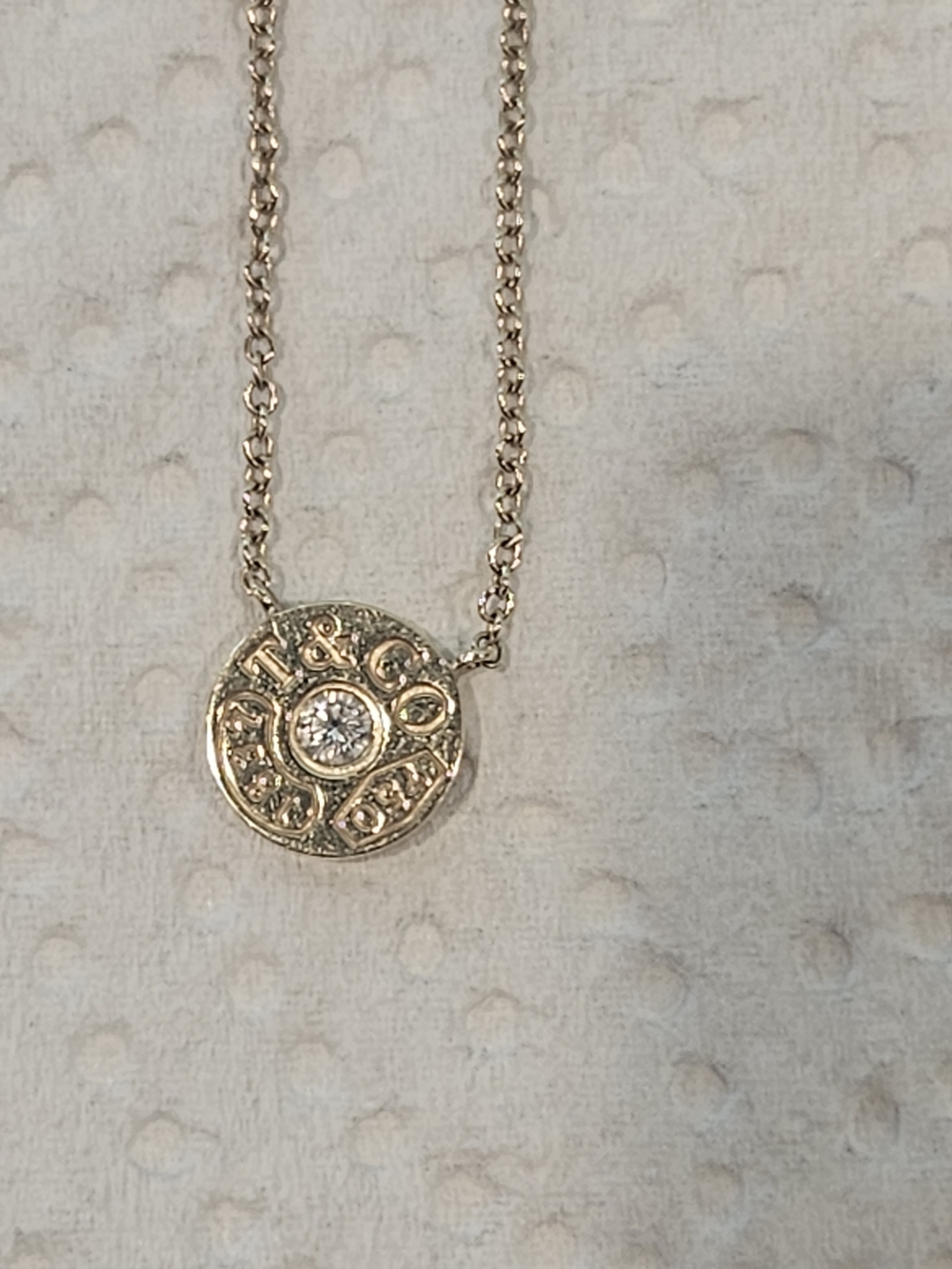 Tiffany & Co. Gold Disc Pendant Necklace with Clear Stone